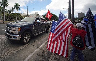 Truck drives by with flags in support of Trump at the Capitol. January 6, 2021