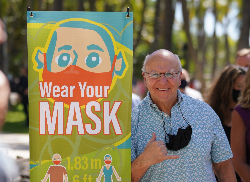 Mayor Rick Blangiardi flashes a shaka after the press conference announcing new COVID-19 informational banners that will installed along Kalakaua Avenue. February 11, 2021