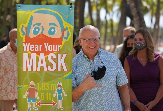 Mayor Rick Blangiardi flashes a shaka after the press conference announcing new COVID-19 informational banners that will installed along Kalakaua Avenue. February 11, 2021