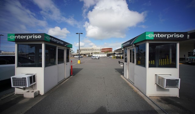 Enterprise Rent-A-Car's rental lot is empty with no cars at Daniel K Inouye International Airport.