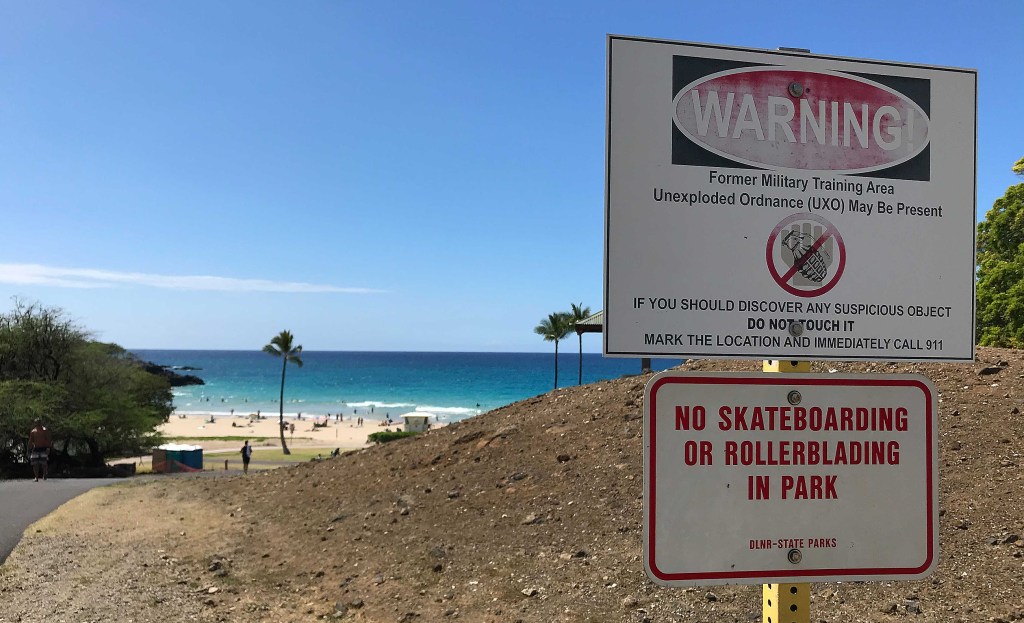 Hapuna Beach sign warning about unexploded ordinance in this forming military training area in Kona, Hawaii.