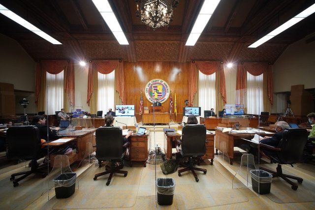 Honolulu City Council members with socially distanced with plexiglass between each member at Honolulu Hale. March 17, 2021