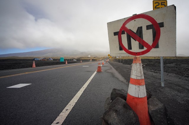 Sign located along the Mauna Kea Access Road near the Saddle Road intersection in opposition to the TMT telescope.