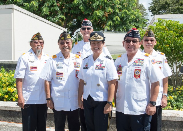 U.S. Navy Brig. Gen. Suzanne P. Vares-Lum, Mobilization Assistant, Strategic Planning and Policy of U.S. Pacific Command, pose for a photo with members of Veterans of Foreign Wars at the 11th Annual Joint Memorial Service at the National Memorial Cemetery of the Pacific in Honolulu, Hawaii, Sept. 25, 2016. The service is to honor Japanese American soldiers who served and sacrificed their lives during WWII. (U.S. Navy photo by Mass Communication Specialist 1st Class Jay M. Chu)