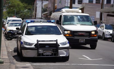 Honolulu Police department vehicle parked along Maunakea Street in Chinatown near the substation.