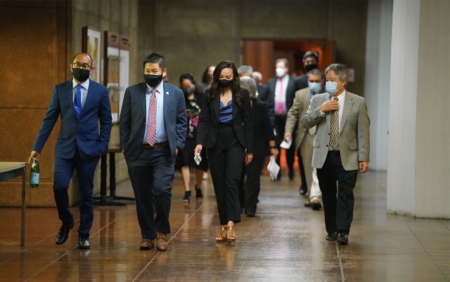 House members walk from the chambers to the auditorium to Caucus during COVID-19 pandemic.