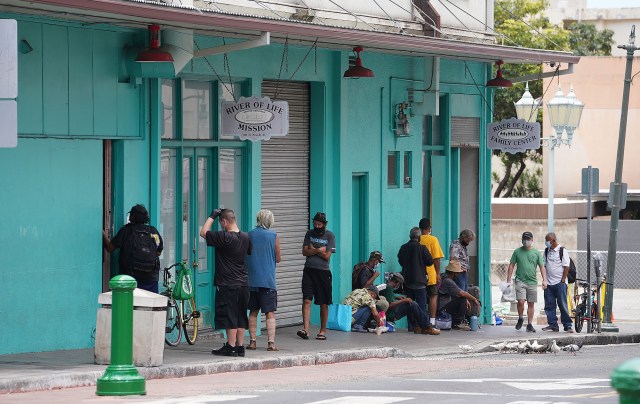 Patrons enjoy lunch at the River of Life Mission located along Pauahi Street in Chinatown.