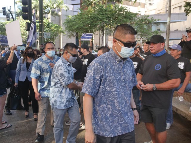 3 HPD officers arriving to make their first court appearance in Honolulu on Friday, June 25, 2021. CIvil Beat photo Ronen Zilberman.