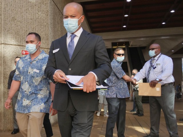 Three HPD officers charged in the shooting death of Iremamber Sykap leaving the Alakea Street courthouse in Honolulu on Friday, June 25, 2021. CIvil Beat photo