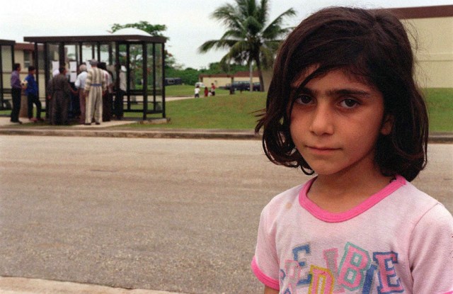 A Kurdish girl stands outside her temporary residence at Andersen Air Force Base, Guam, while being housed at the base as part of Operation PACIFIC HAVEN. The operation, a joint humanitarian effort conducted by the US military, entails the evacuation of over 2,100 Kurds from northern Iraq to avoid retaliation from Iraq for working with the US government and international humanitarian agencies. The Kurds will be housed at Andersen AFB, while they go through the immigration process for residence in the United States.