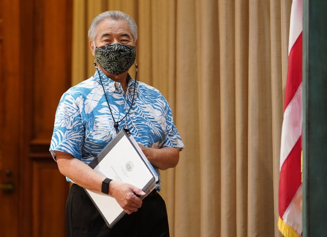 Governor David Ige walks into ceremonial room before the press conference starts. Ige was announcing bills that he will veto.
