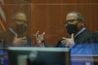 Judge William M. Domingo gestures during the final day of preliminary hearings for three Honolulu police officers accused in the killing of Iremamber Sykap on Wednesday, Aug. 18, 2021, in Honolulu. Judge Domingo ruled no probably cause in the killing of Iremamber Sykap.