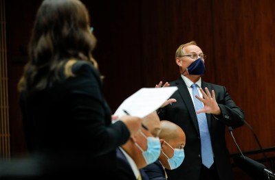 Prosecuting attorney Christopher Van Marter, right, gestures while objecting to statements from defense attorney Crystal Glendon, left, as defense attorneys Thomas Otake, bottom right, and Richard Sing look on in the district courtroom of Judge William M. Domingo during preliminary hearings for three Honolulu police officers in the killing of Iremamber Sykap on Tuesday, Aug. 17, 2021, in Honolulu. (POOL PHOTO/Jamm Aquino/Honolulu Star-Advertiser).