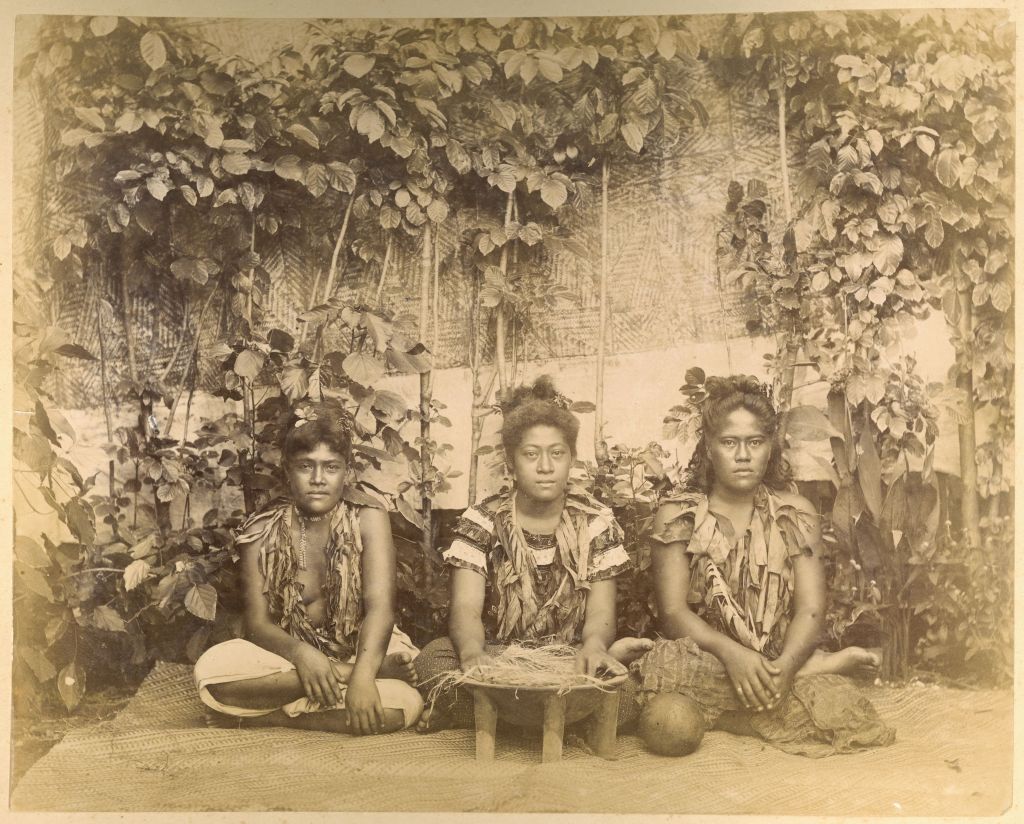 In a picture taken in 1890, three Samoan women pose as they prepare to make kava