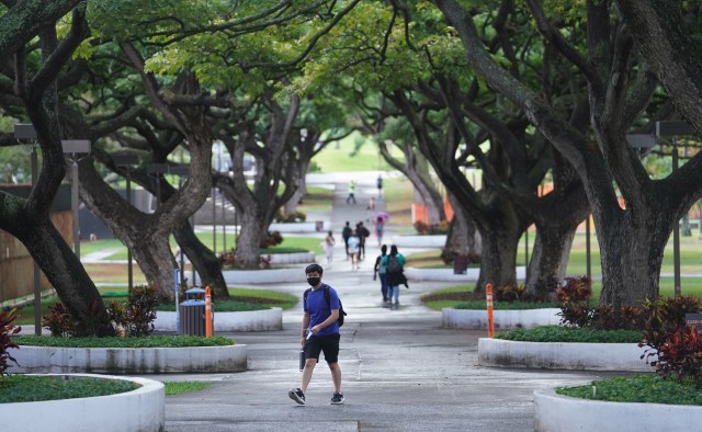 University of Hawaii at Manoa first day of fall instruction as students walk thru the mall in the morning during a Covid-19 surge. August 23, 2021