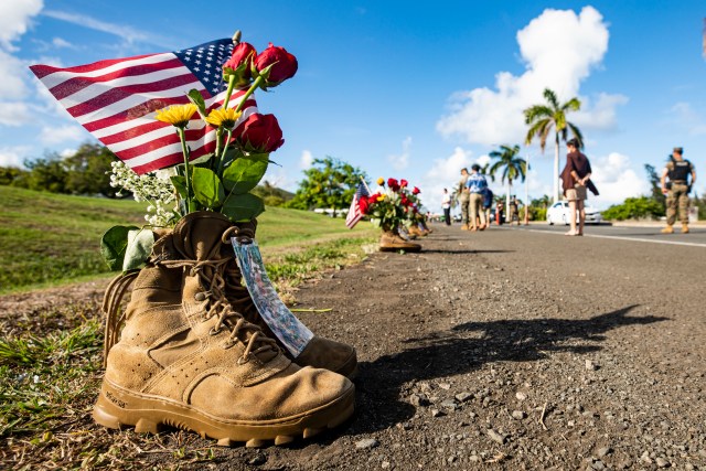 A pair of boots is displayed as part of a memorial aboard Marine Corps Base Hawaii, Aug. 29, 2021, in remembrance of the 13 service members recently killed in Afghanistan. The memorial, comprised of community donations, was displayed at the entrance of MCBH. (U.S. Marine Corps photo by Lance Cpl. Samantha Sanchez)