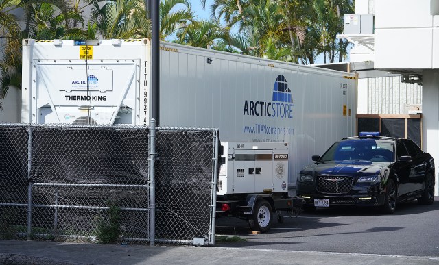 A large white refrigerated container sits in the parking lot of the Department of the Medical Examiner during a surge in Covid-19 cases statewide. September 2, 2021.