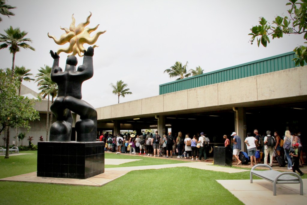 SHIGE YAMADA's sculpture 'Maui releases the Sun' gets little attention from passengers who want to be released from the airport ....