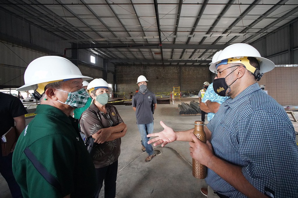 Right, Senator Donovan Dela Cruz speaks to left, UH Vice President of Adminstrative Affairs Michael Unebasami with left, Senator Michelle Kidani at the Wahiawa Value Added Product Development Center under construction.
