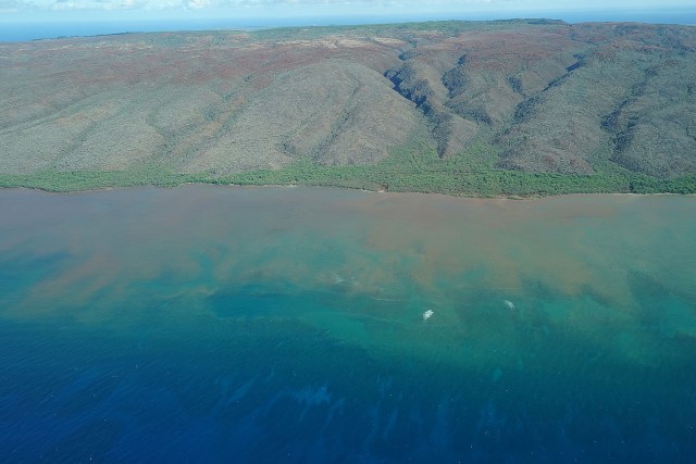 Red dirt runoff blankets the south west waters of Molokai.