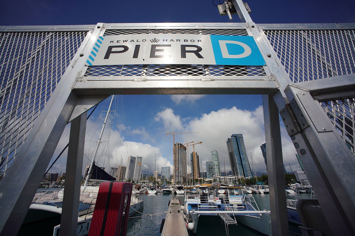 Kewalo Basin Harbor with Kakaako condominium skyline and ongoing construction.