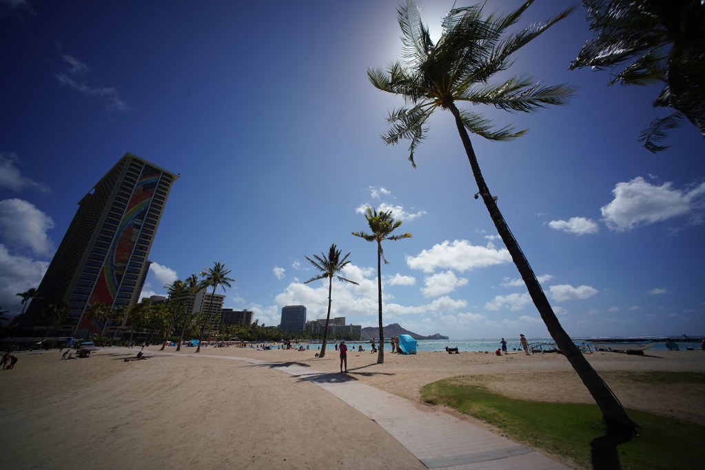 Noticeably lessvisitors on Waikiki Beach near the HIlton Hawaiian Village.