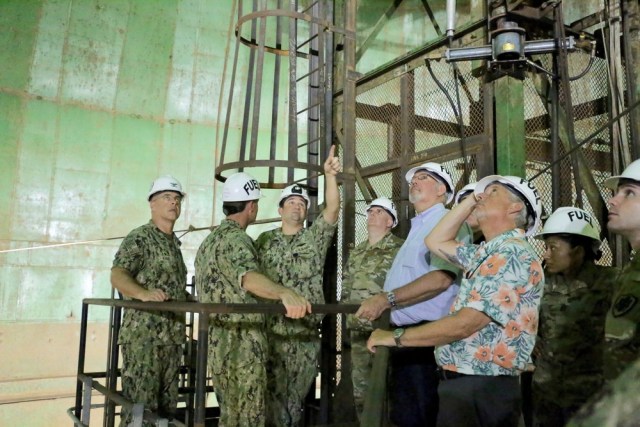 Navy Lt. Cmdr. Blake Whittle, fuel department director for the NAVSUP Fleet Logistics Center Pearl Harbor briefs officials on the Red Hill fuel tanks in 2019.