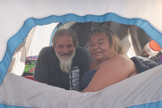 Jared Castro and Georgette Preston returned to the Moiliili Neighborhood Park were able to borrow a tent from their friend after the city seized their belongings.