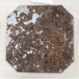 A "coupon," or sample" taken from one of the Red Hill fuel facility tanks shows the level of corrosion the steel has undergone.