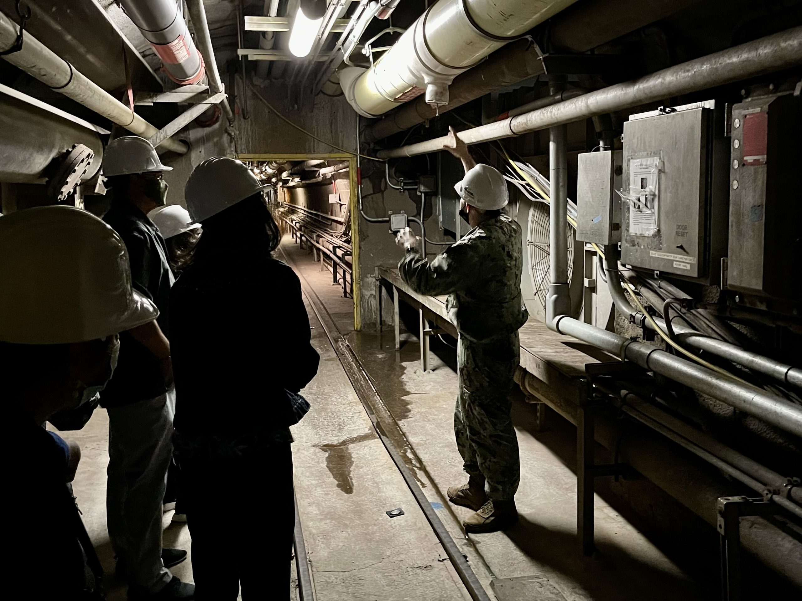 Lawmakers toured the Red Hill Bulk Fuel Storage Facility on Jan. 6, 2022. Pictured: A Navy official shows lawmakers the fire suppression drain line that released 14,000 gallons of water and fuel on Nov. 20, 2021.