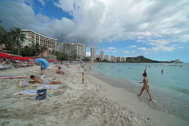 Beachgoers and visitors enjoy the sunshine in Waikiki during a surge in Covid-19 cases. Today we had 4789 Covid-19 positive cases reported. January 5, 2022.