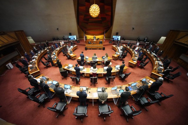 House members gather at the beginning of the first public in person floor session.