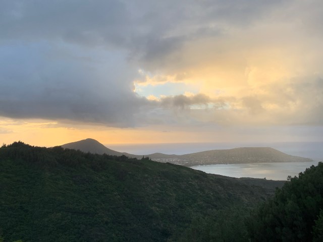 the sun rises behind Koko Head