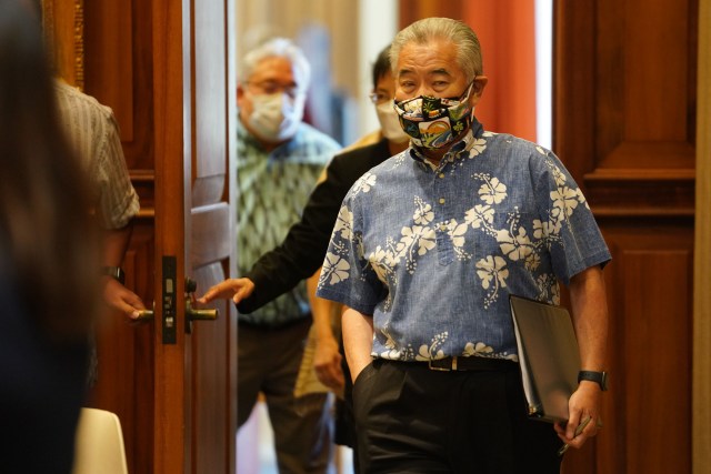 Governor David Ige enters before the Covid-19 press conference held at the Capitol.