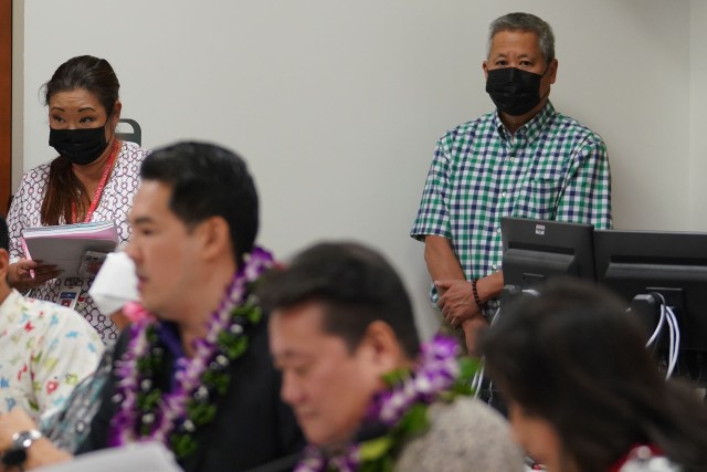 Speaker Scott Saiki stands at the back of the room during joing House and Senate budget conference committee meeting held at the Capitol.