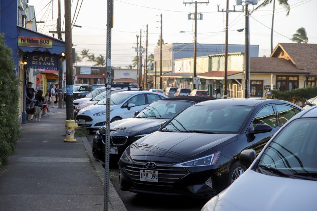 A photo of cars parked on the street in Paia.