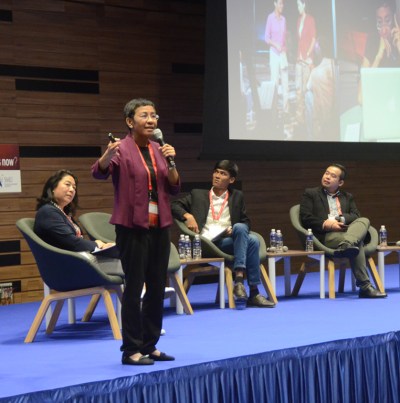 Maria Ressa speaking at the East-West Center's media conference in Singapore in 2018.