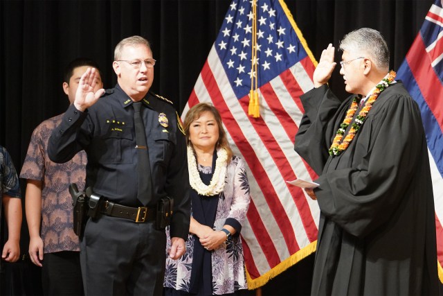HPD Honolulu Police Chief Joe Logan is sworn in by Judge Edward Kubo at the Mission Memorial Auditorium.