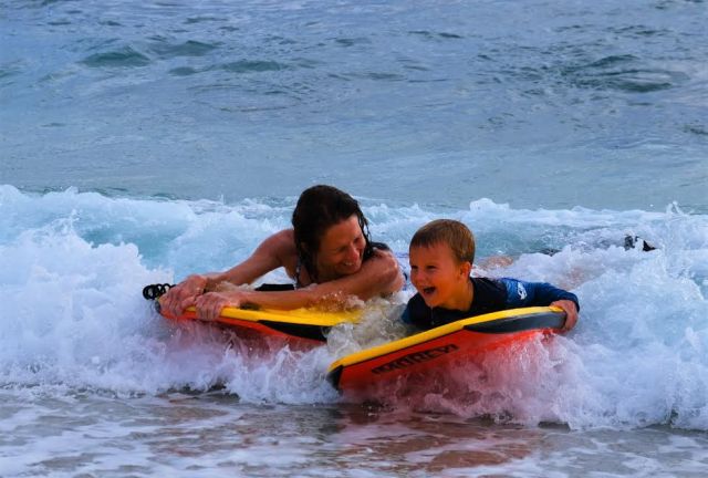 Deb Goodwin boogie boarding with J.J.