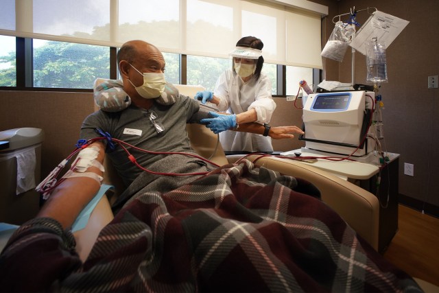 Kalani Pagan receives dialysis during a 5-week training on how to use the machines with registered nurse Linda Tsui RN looking on. The process takes a little under 3 hours.