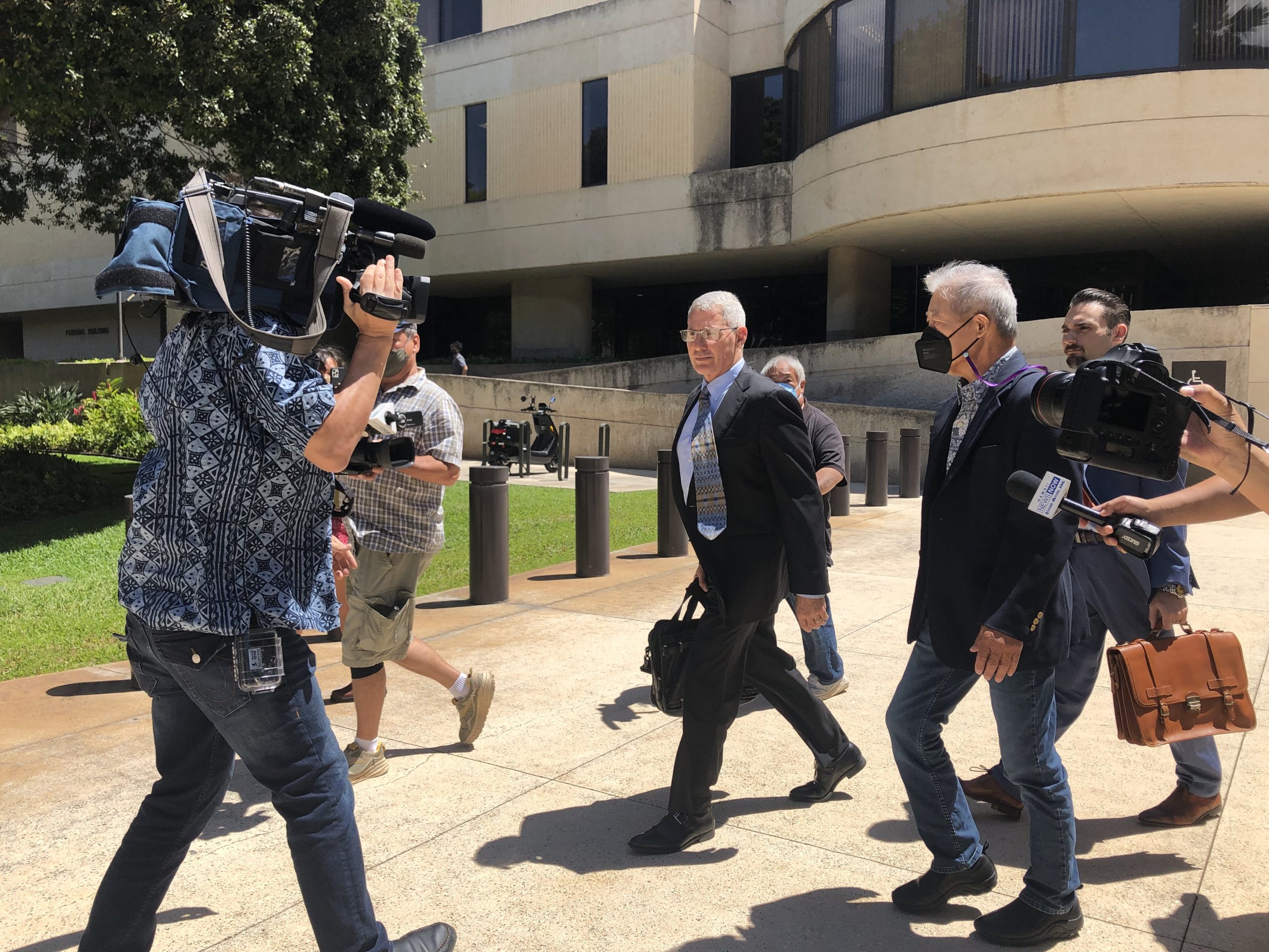 Former Honolulu Prosecuting Attorney Keith Kaneshiro and his attorney Myles Breiner left the federal courthouse on Friday, June 17, 2022. Kaneshiro pleaded not guilty to federal charges of conspiracy and bribery regarding on of his campaign donors, Dennis Mitsunaga.
