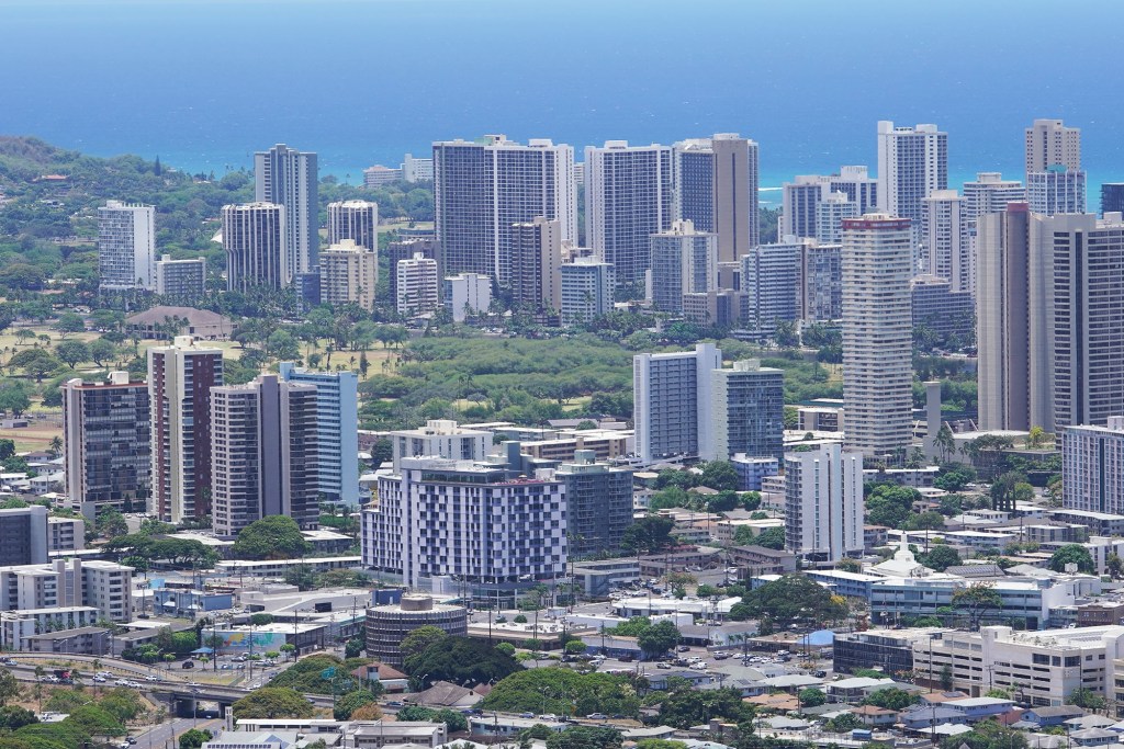 A mix of apartments, condominiums, and hotels dot the skyline in urban Honolulu.