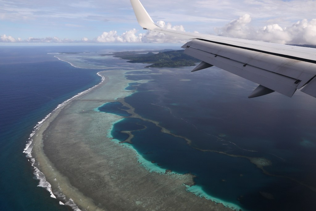 The aerial photo shows Pohnpei International Airport in Kolonia, Federated States of Micronesia, on Aug. 5, 2019. Micronesia has likely become the final nation in the world with a population of more than 100,000 to experience an outbreak of COVID-19. On Tuesday, July 19, 2022, the government announced it had become aware of multiple cases across two of the nation's four states.(Jonathan Ernst/Pool Photo via AP, File)