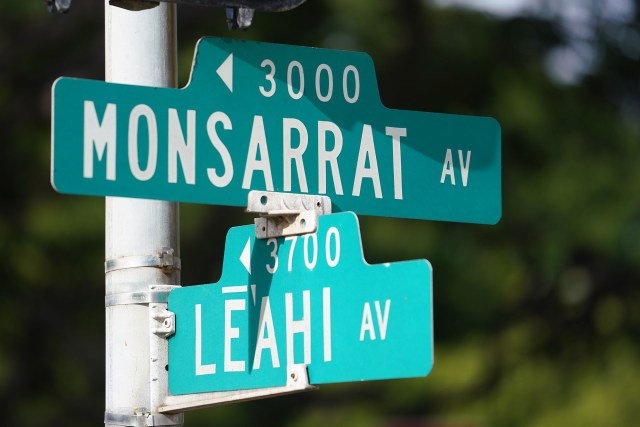Street signs located at the intersection of Leahi Avenue and Monsarrat Avenue.