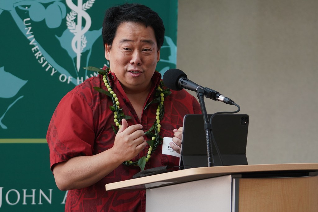 Representative Ryan Yamane speaks before bills SB2657 and SB2597 are signed by the Governor into law at the John A. Burns School of Medicine.