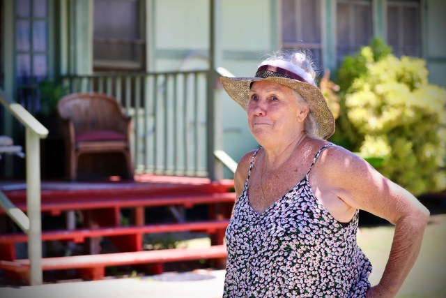 Bridget Mowat stands outside her home on a Hawaiian homestead on Molokai.