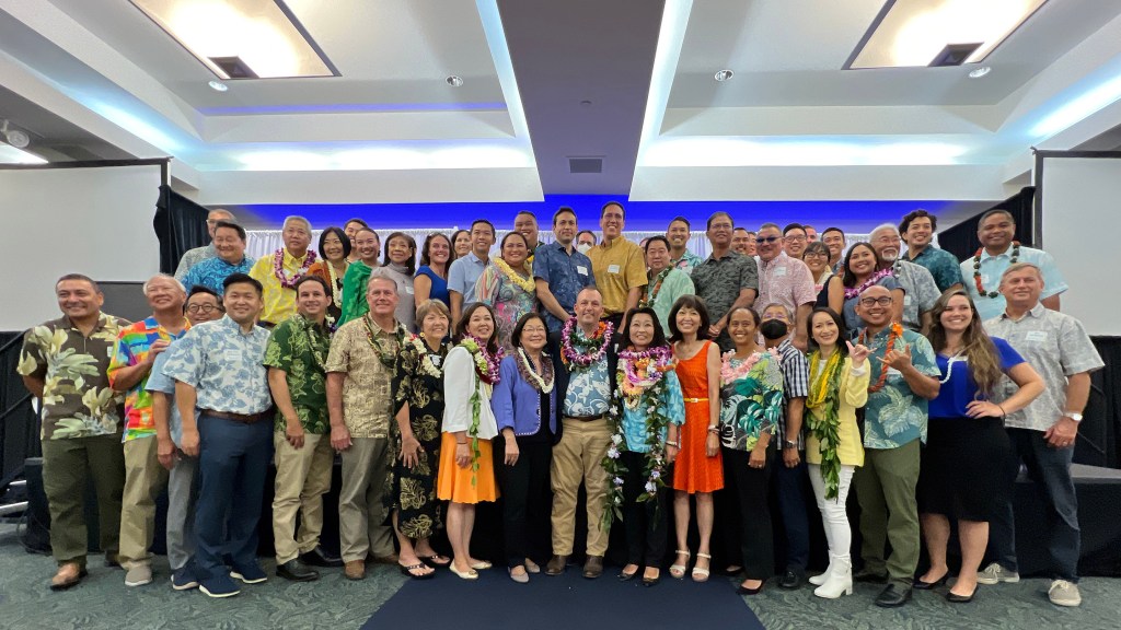 Democratic candidates gathering on stage during the Democratic Party of Hawaii Unity Breakfast. Civil Beat photos Ronen Zilberman.