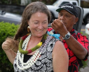Senator Laura Acasio is greeted with a feather lei by supporter Richard Tiogangco as she waits for Saturday's election results at her Hilo Headquarters Photo: Tim Wright.