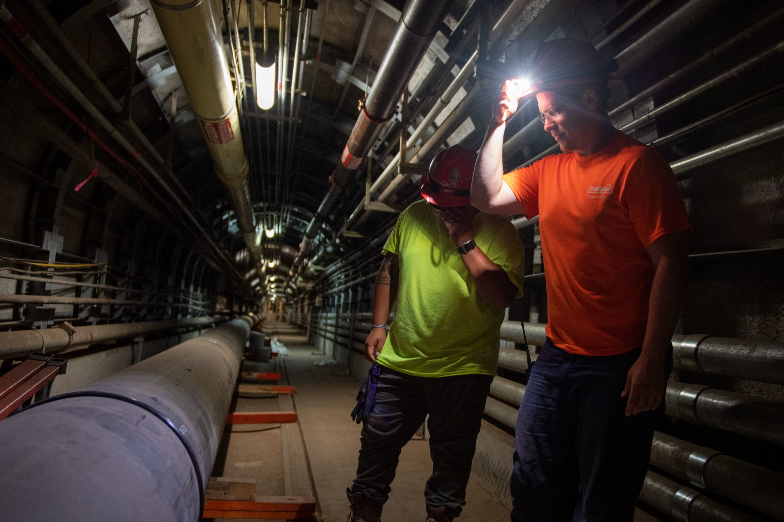 AIEA, Hawaii (April 11, 2022) Naval Facilities Engineering Systems Command contractors Matt Cornman, front, and Jonathan Martinez perform a routine inspection on a water pipe that connects to a granular activated carbon system at the Red Hill Well. The U.S. Navy continues to work with federal, state and local organizations to support families and residents, conduct long-term monitoring of the Navy water system, and work toward remediating Red Hill Well and the surrounding area. For detailed information, go to: www.navy.mil/jointbasewater. (U.S. Navy photo by Mass Communication Specialist 2nd Class Mar’Queon A. D. Tramble)