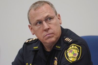 Honolulu Police Chief Joe Logan listens to Commissioner Chin on screen during the Honolulu Police Commission meeting.
